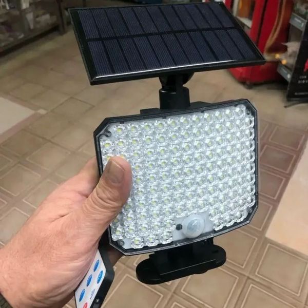 Світильник на сонячній батареї з датчиком руху Solar wall lamp SMD104 фото